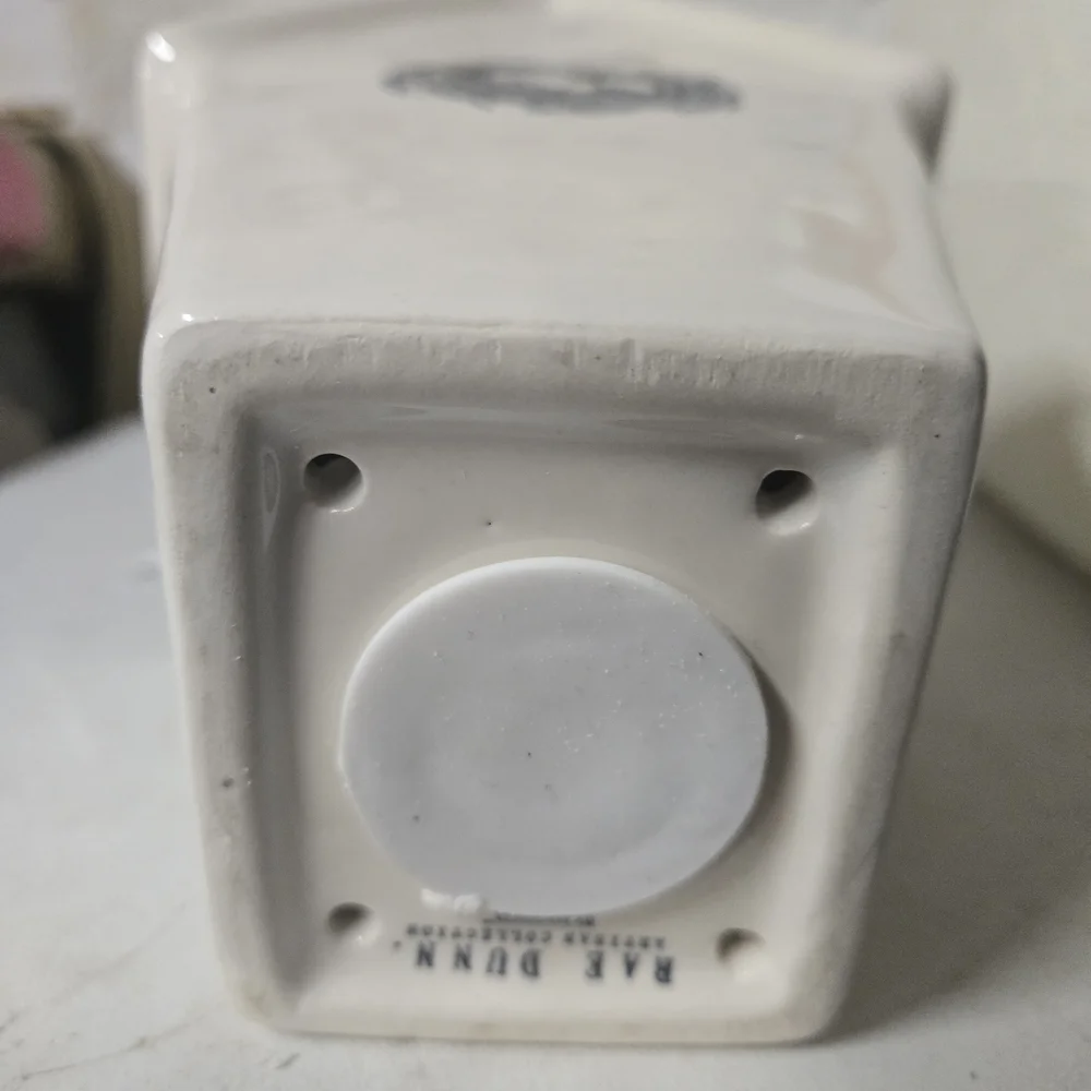 White Ceramic Birdhouse with 'Rest' Inscription